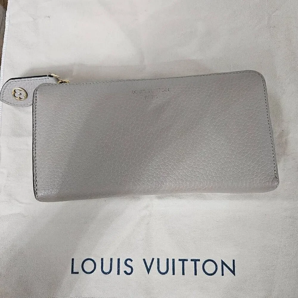 Louis Vuitton Taurillon portefeuille Comete long zip wallet